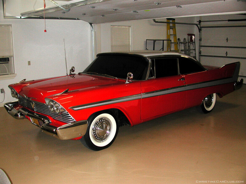 Red classic car in garage