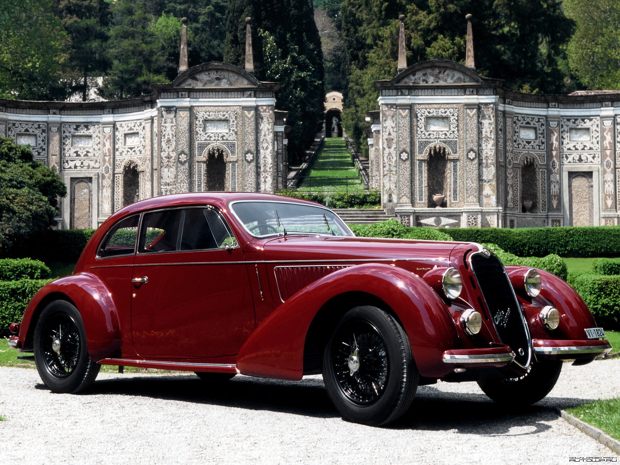 Red classic car in garden