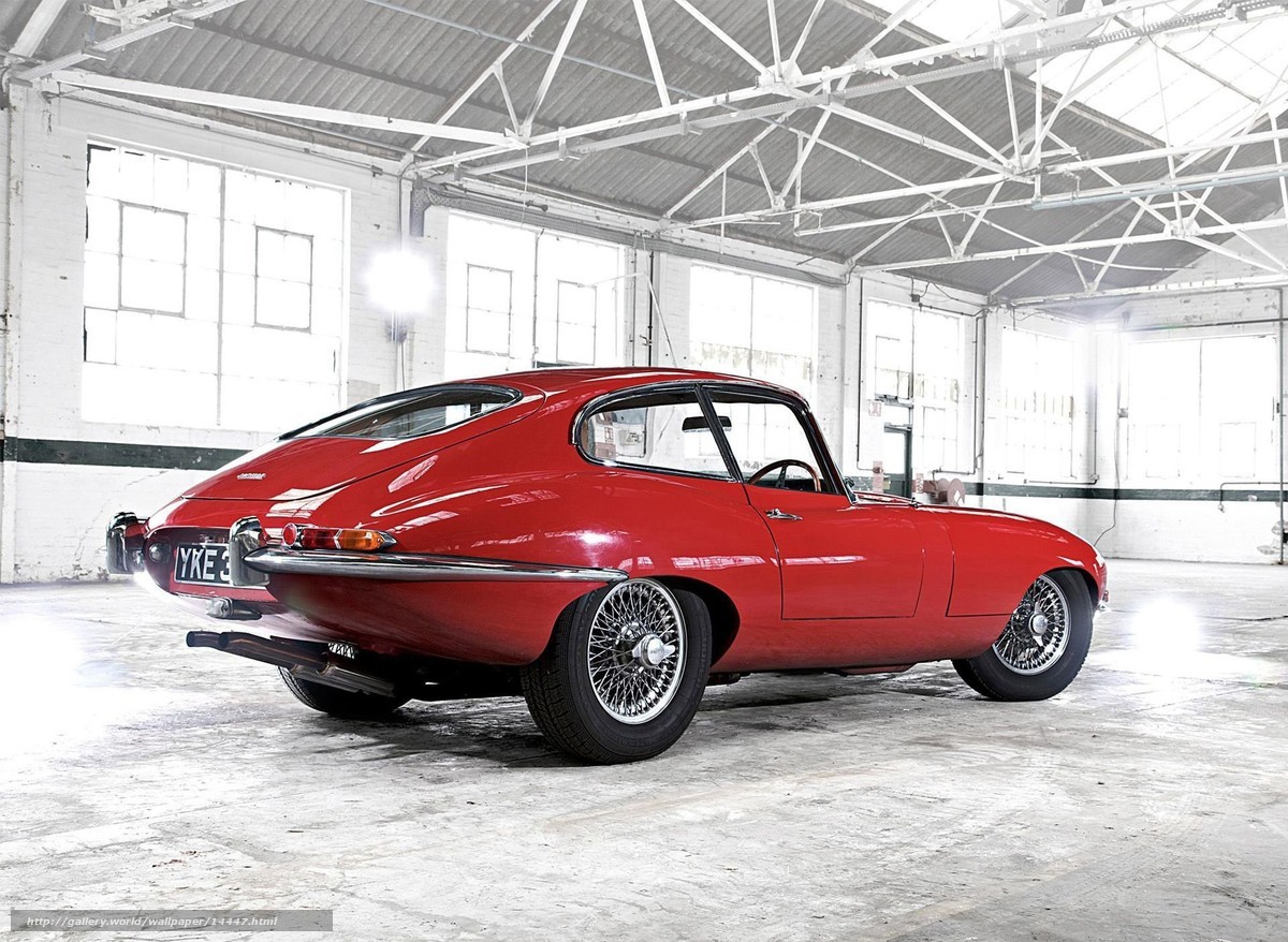 Red classic car in warehouse
