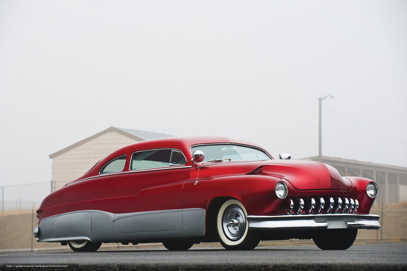 Red classic car on a foggy day