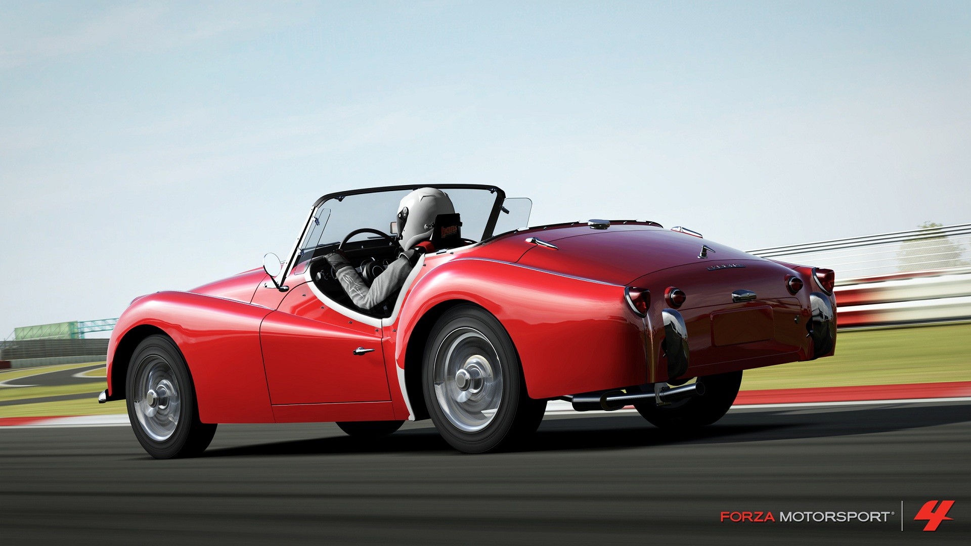 Red classic car on a racetrack