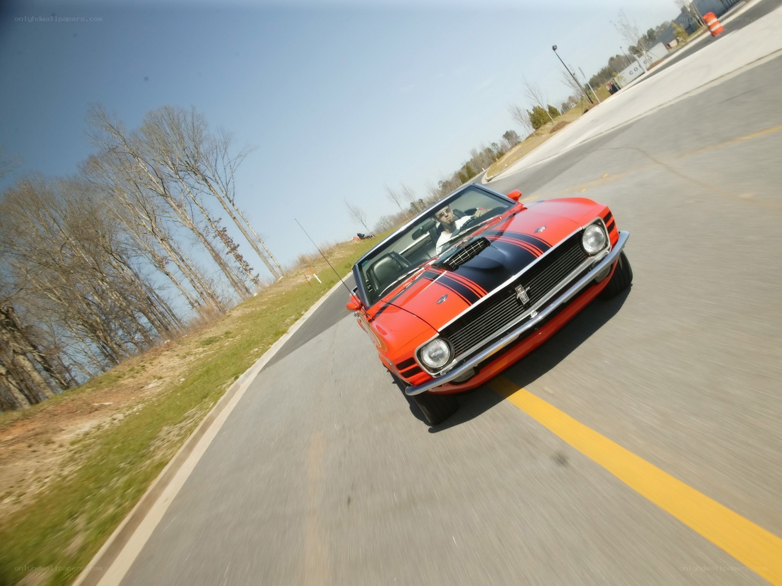 Red classic car on a road