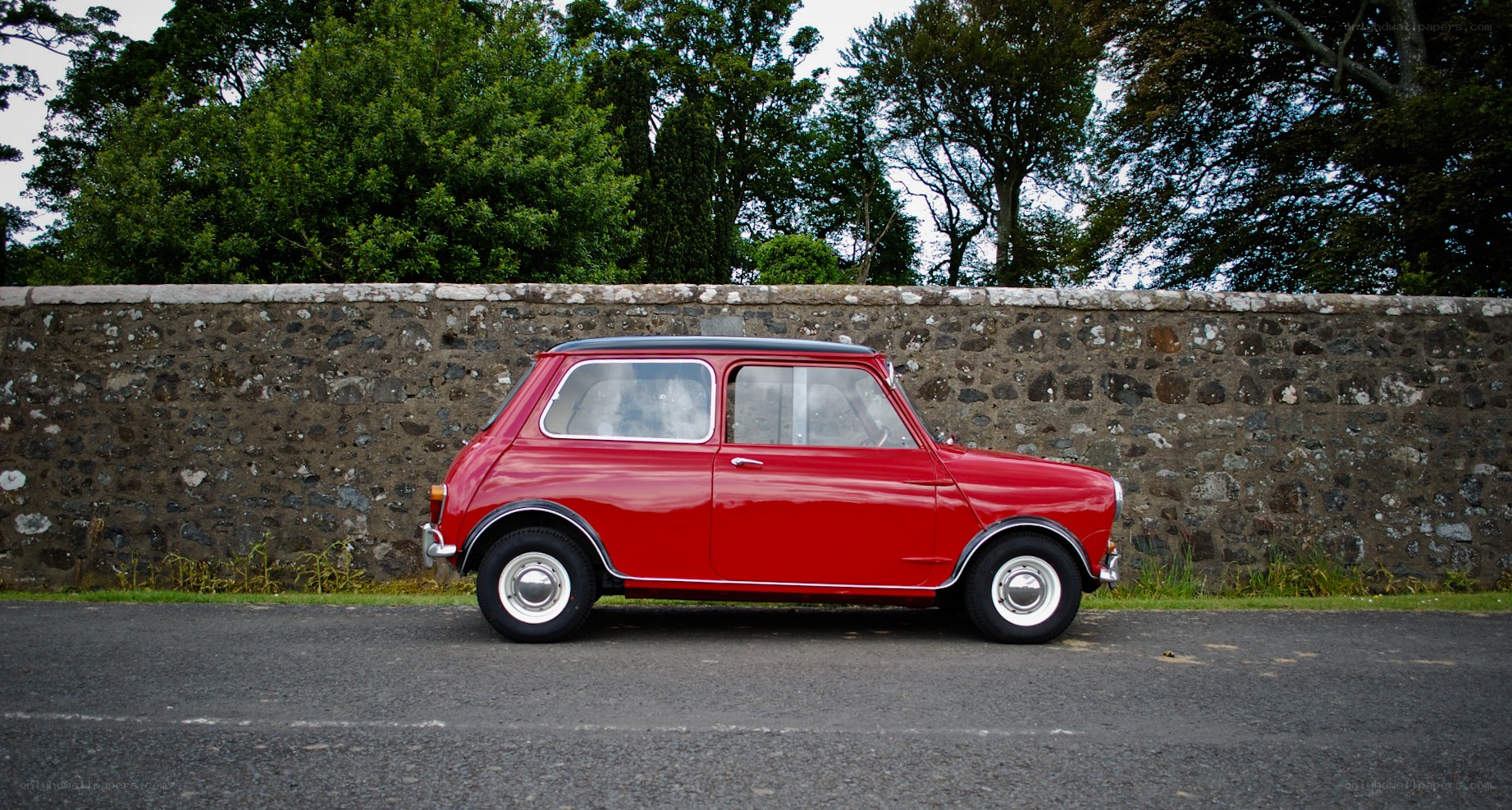 Red classic car on a road