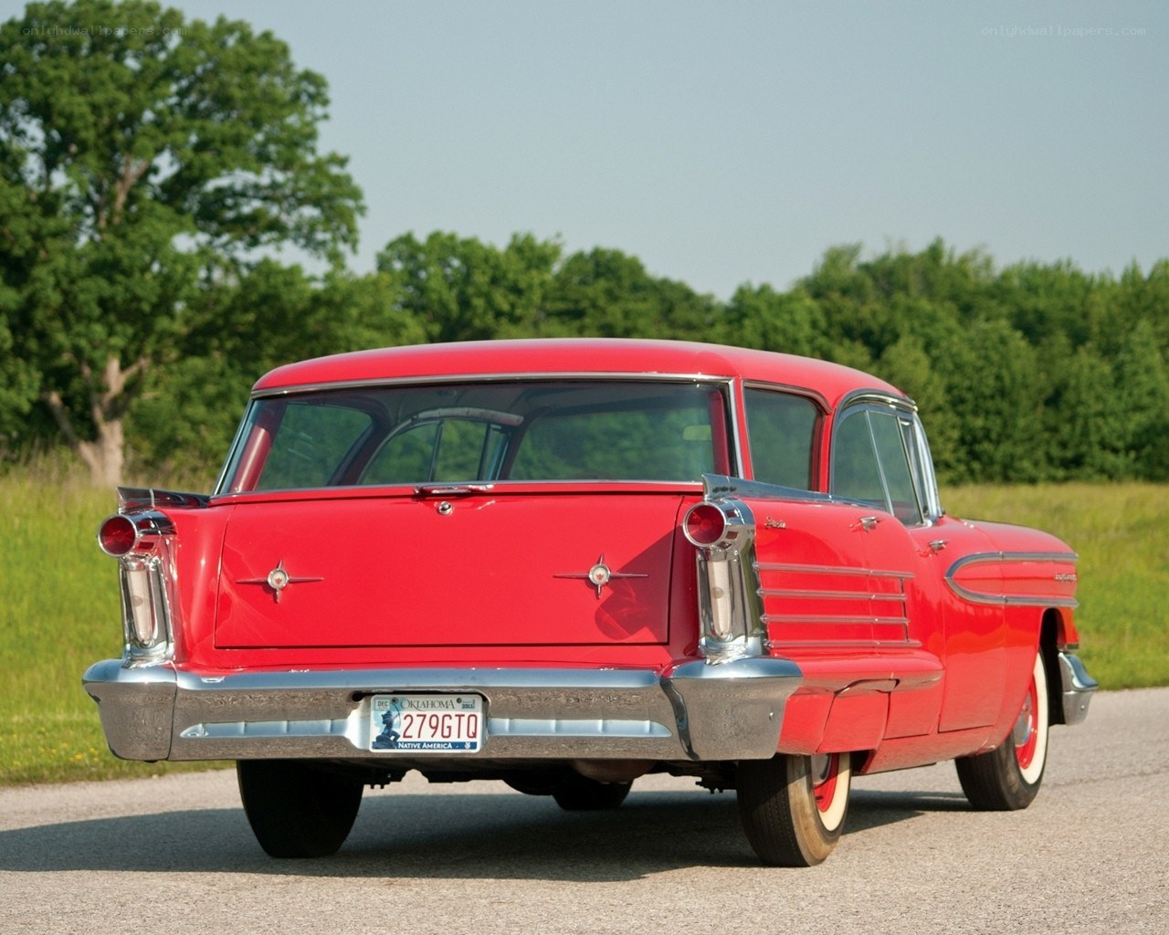 Red classic car on a road
