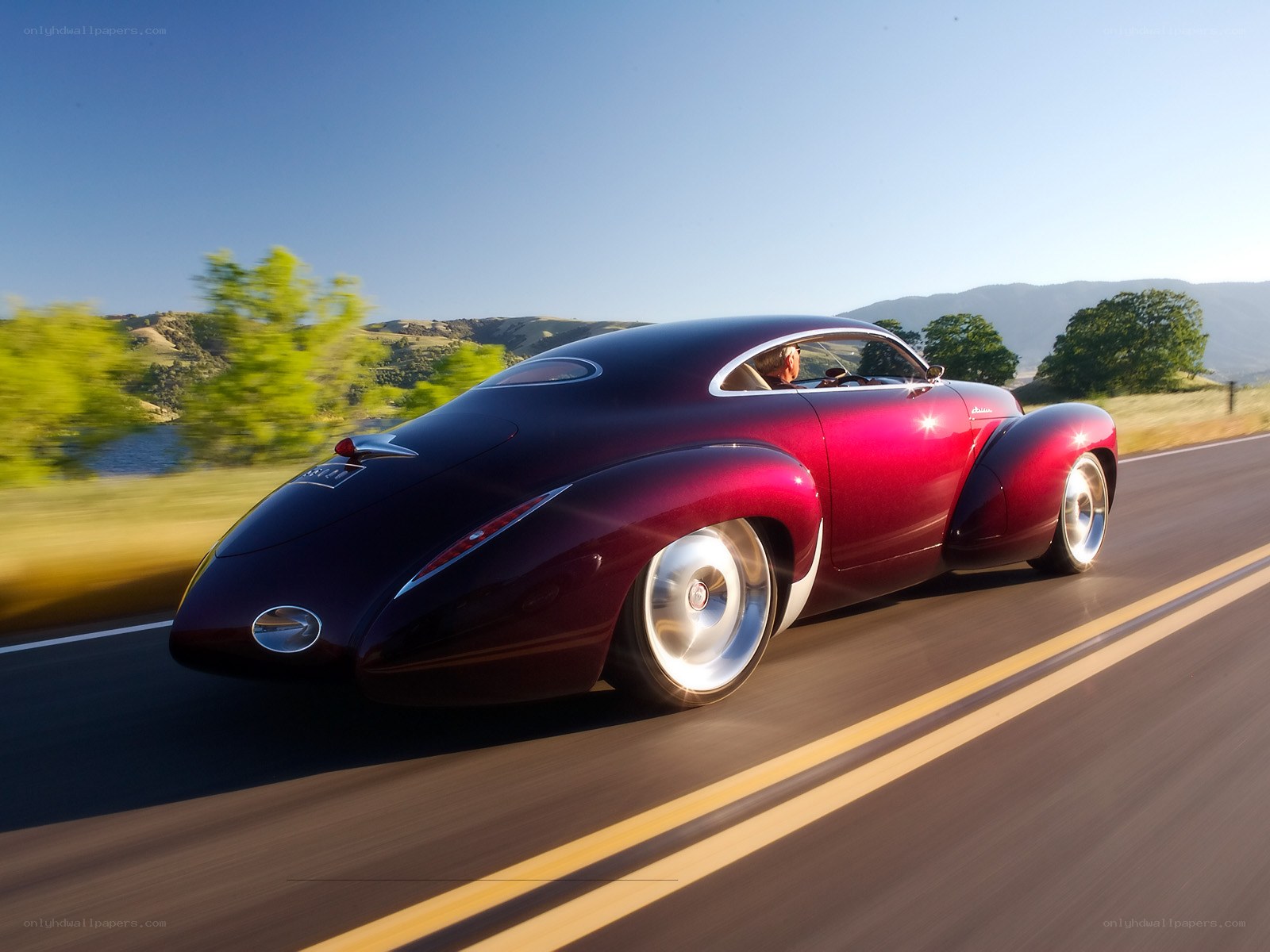 Red classic car on a road
