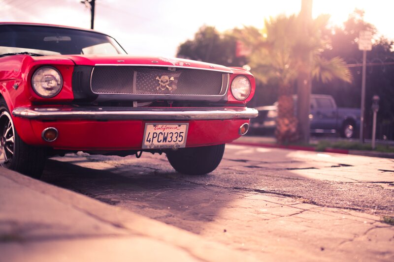 Red classic car on a street