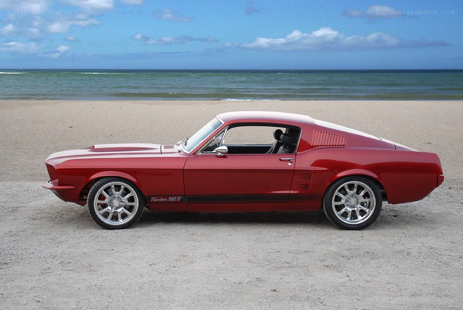 Red classic car on beach