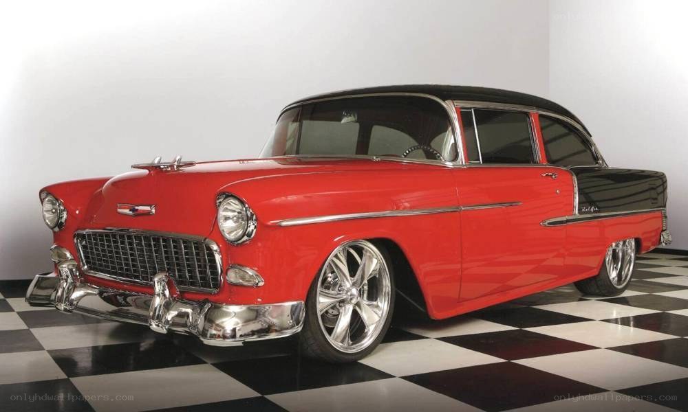 red classic car on checkered floor