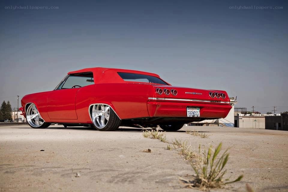 red classic car on concrete