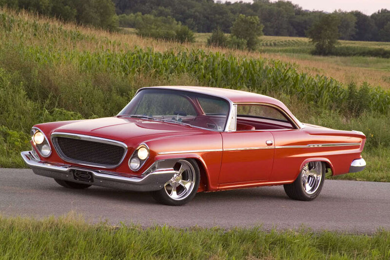 Red classic car on country road