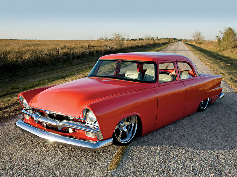 Red classic car on country road