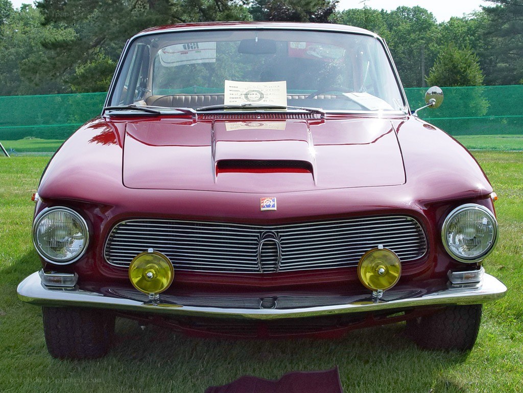 Red classic car on display