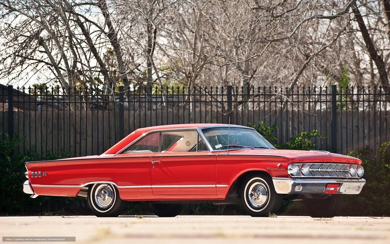 Red classic car on display
