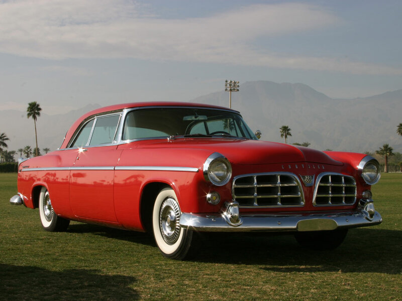 Red classic car on grass