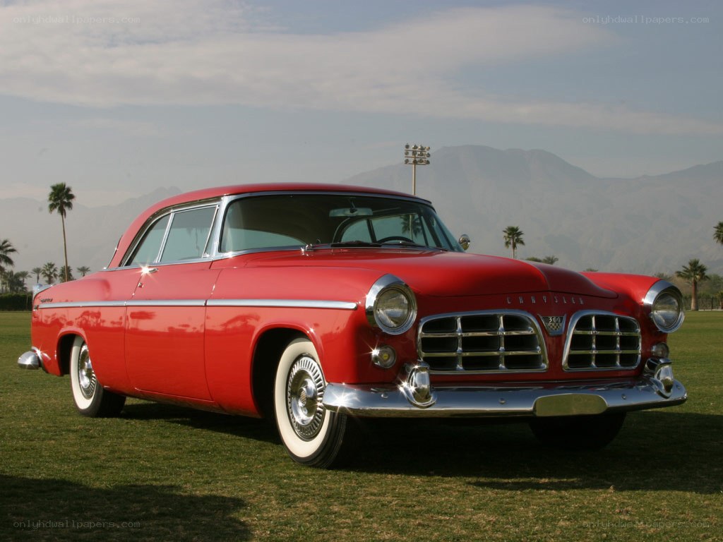 Red classic car on grass