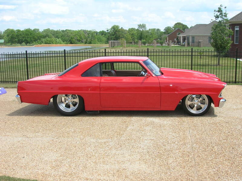 red classic car on gravel