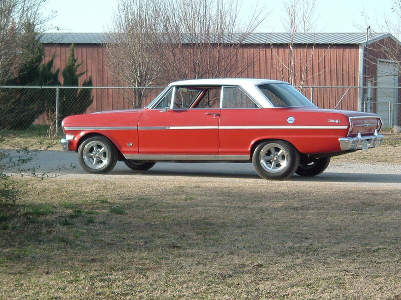 Red classic car on gravel