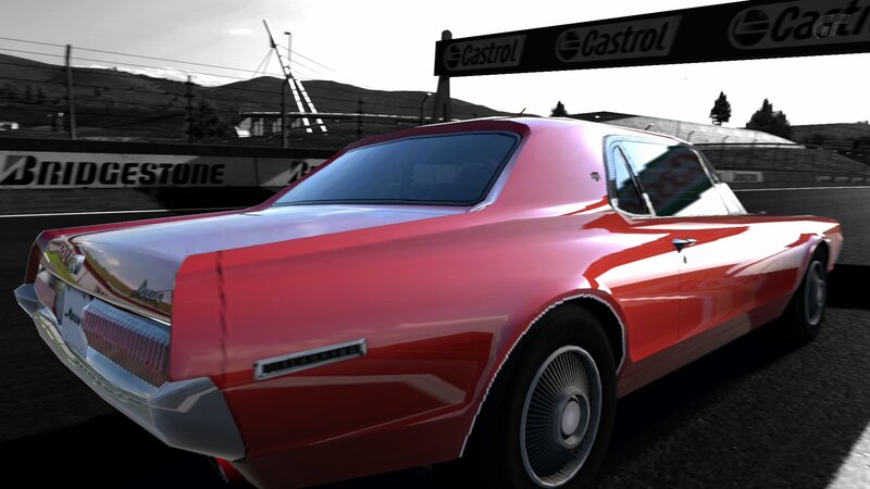 Red classic car on racetrack