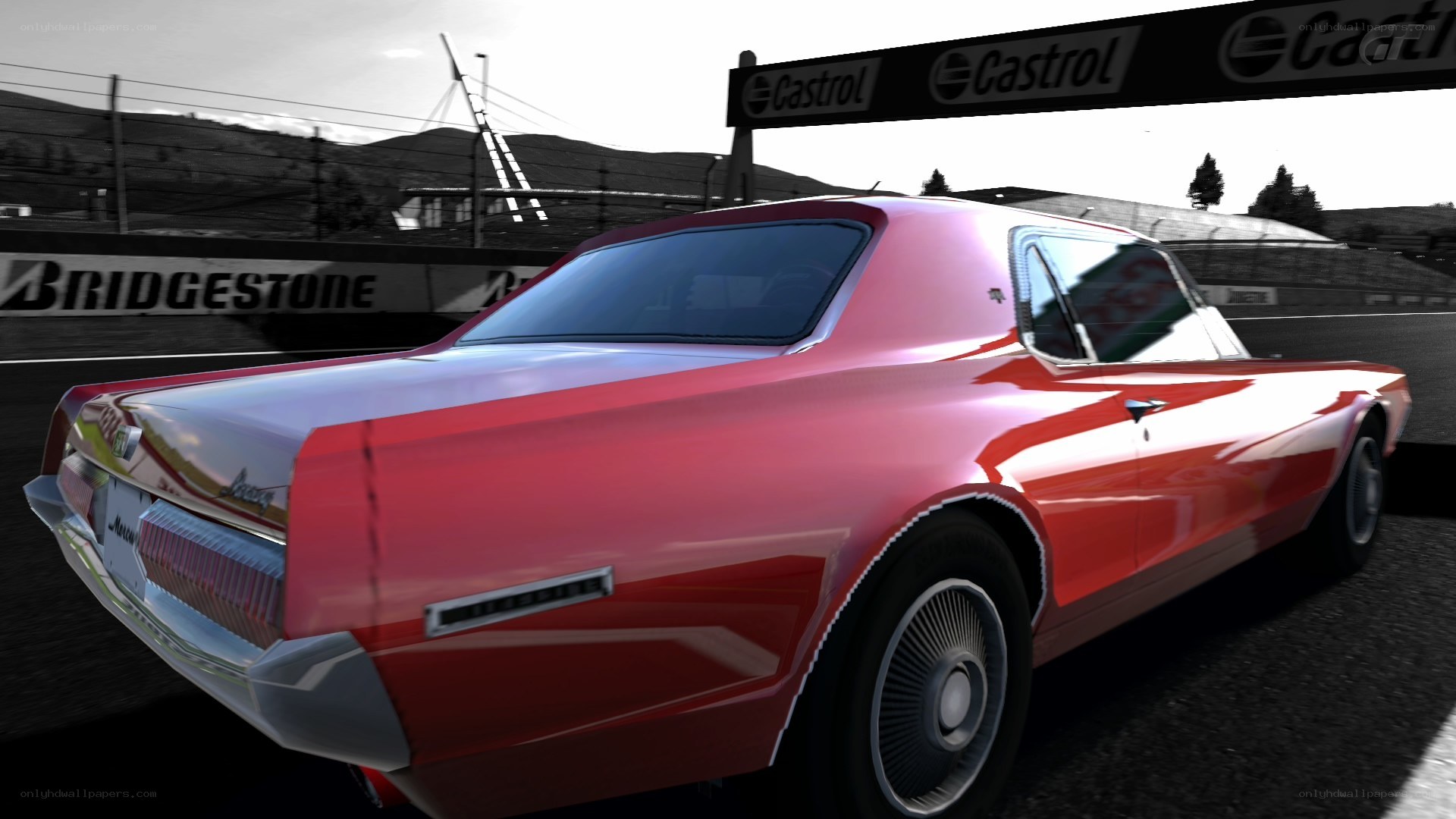 Red classic car on racetrack