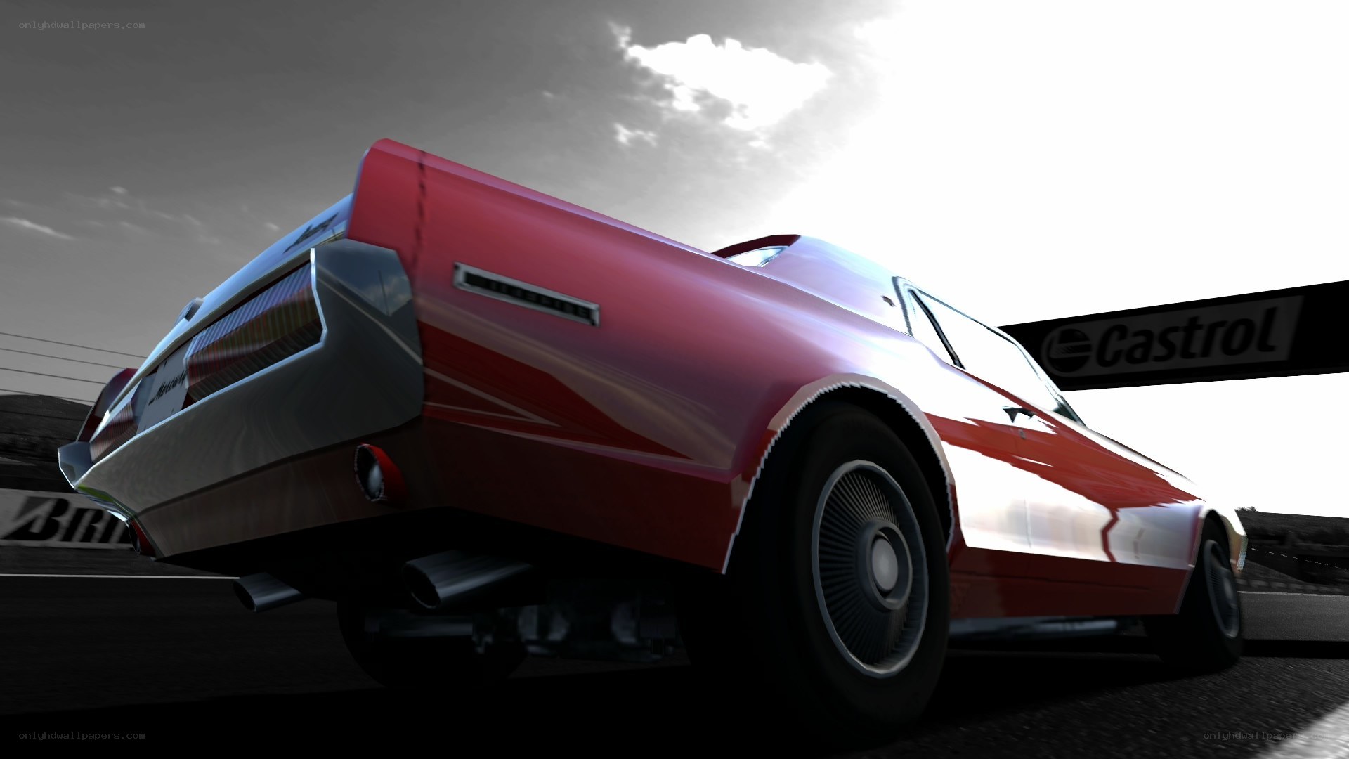 Red classic car on racetrack