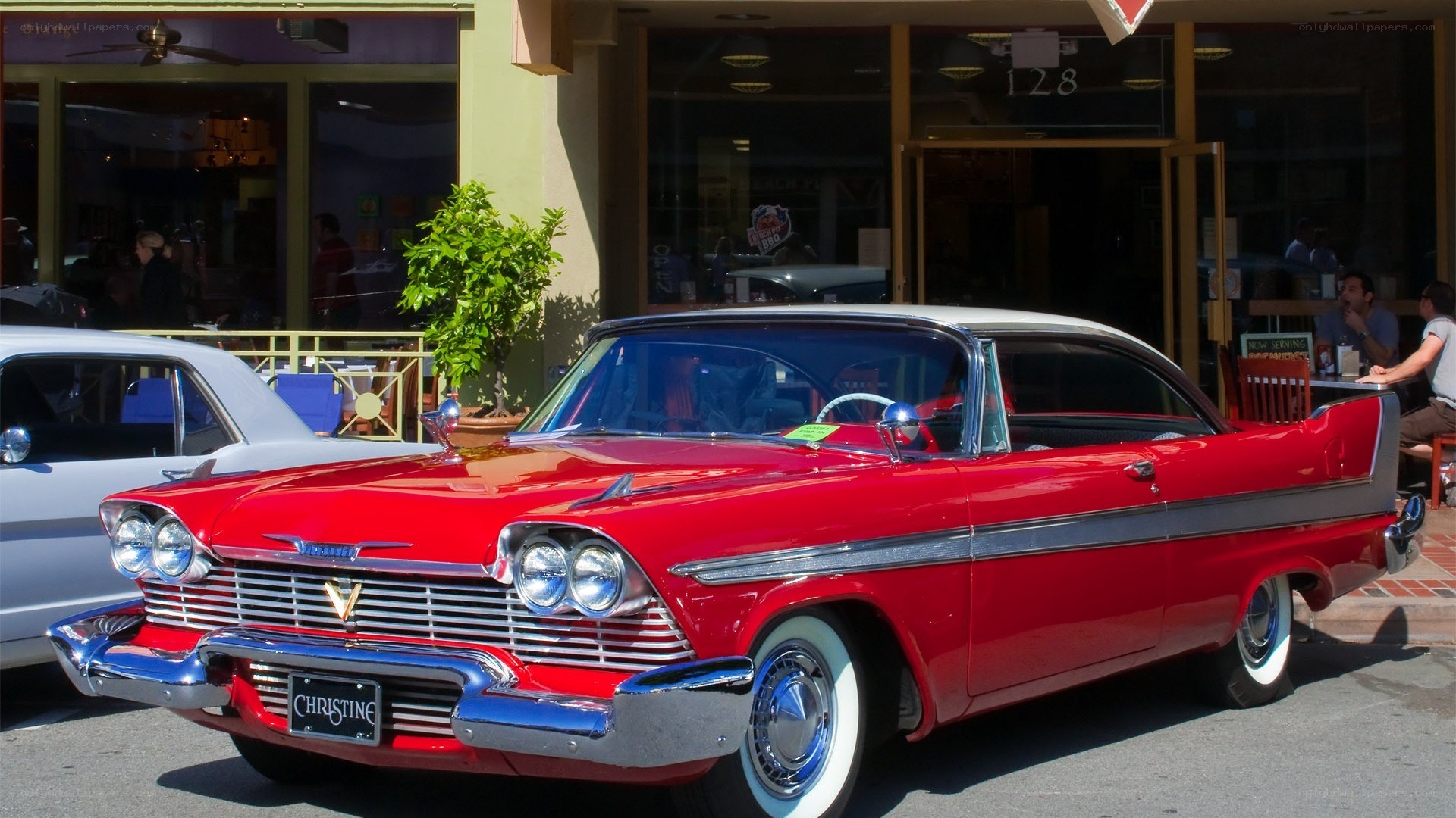 Red classic car on street
