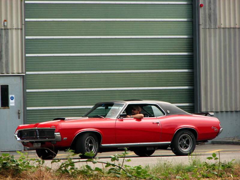Red classic car on street