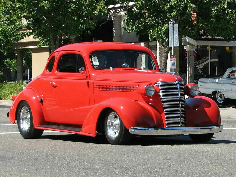Red classic car on street