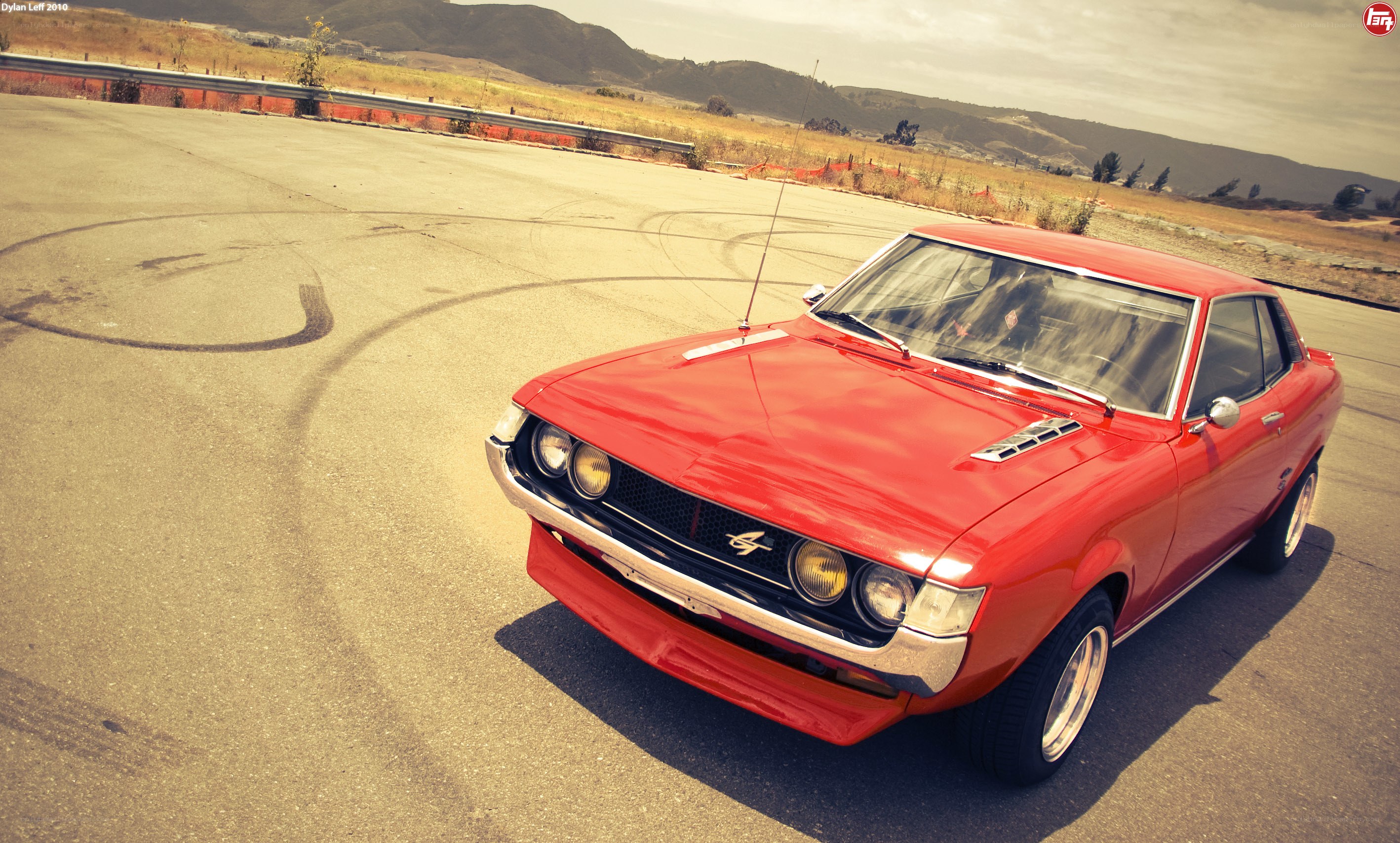 Red classic car on track