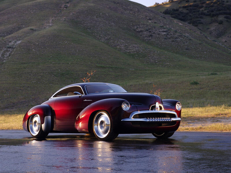 Red classic car on wet road