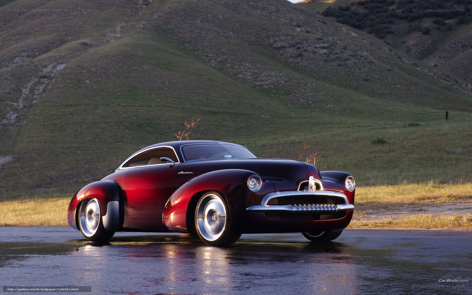 Red classic car on wet road