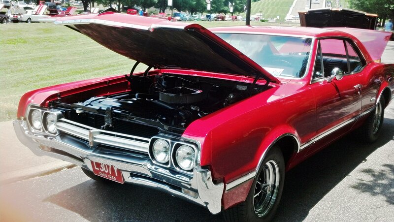 Red Classic Car — Showcase, Afternoon, Photograph, Car Show, Grass Field