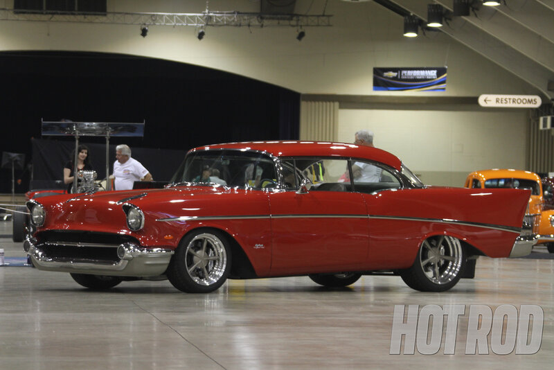 Red Classic Car — Showroom, Photograph, People