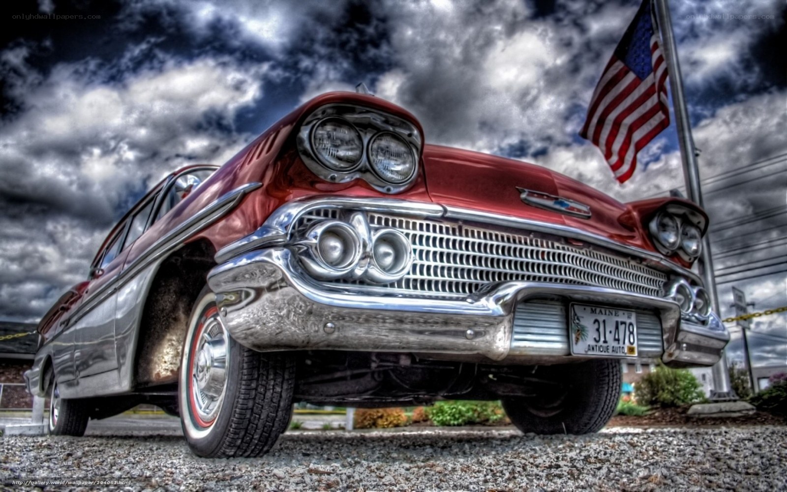 Red classic car with American flag