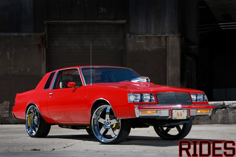 Red classic car with custom wheels