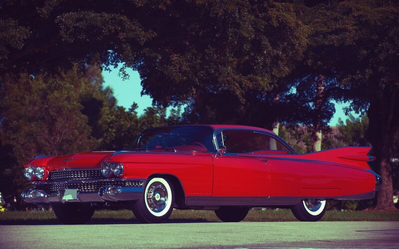 Red classic car with tail fins