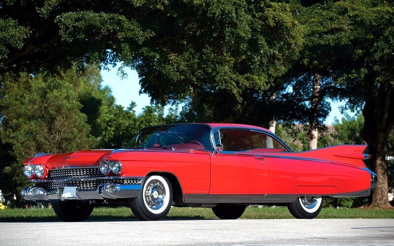 Red classic car with tail fins