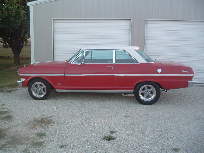 Red classic car with white roof