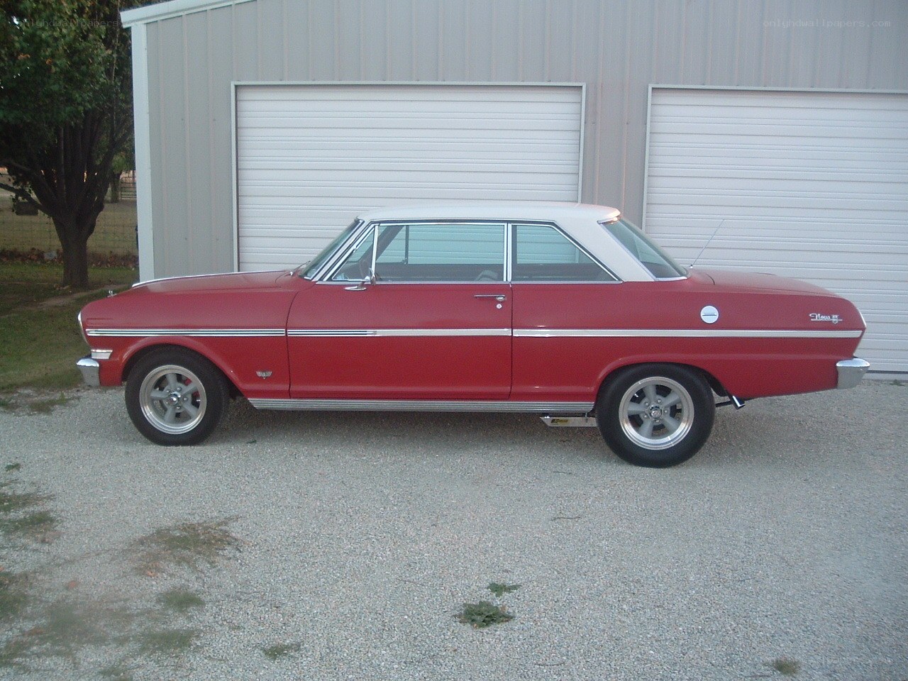 Red classic car with white roof