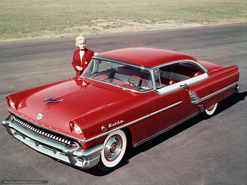 Red classic car with woman