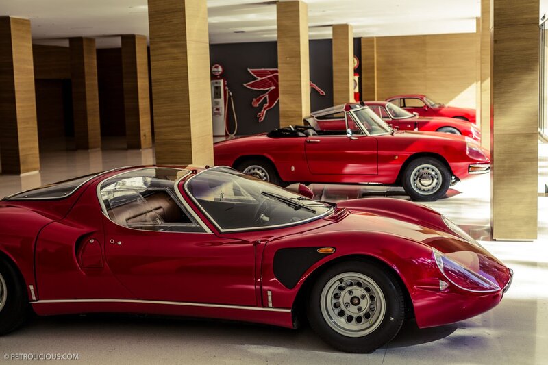 Red classic cars in a showroom