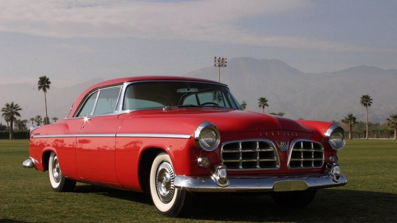 Red classic Chrysler on a grassy field