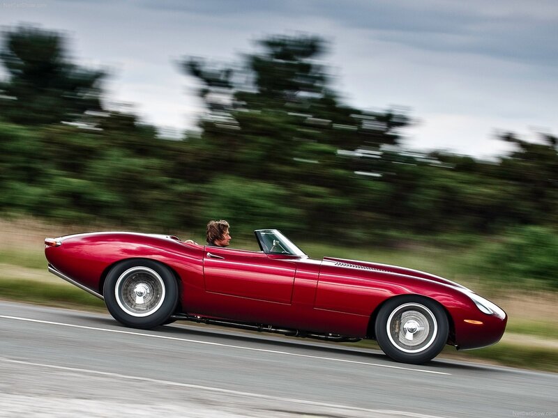 Red classic convertible in motion