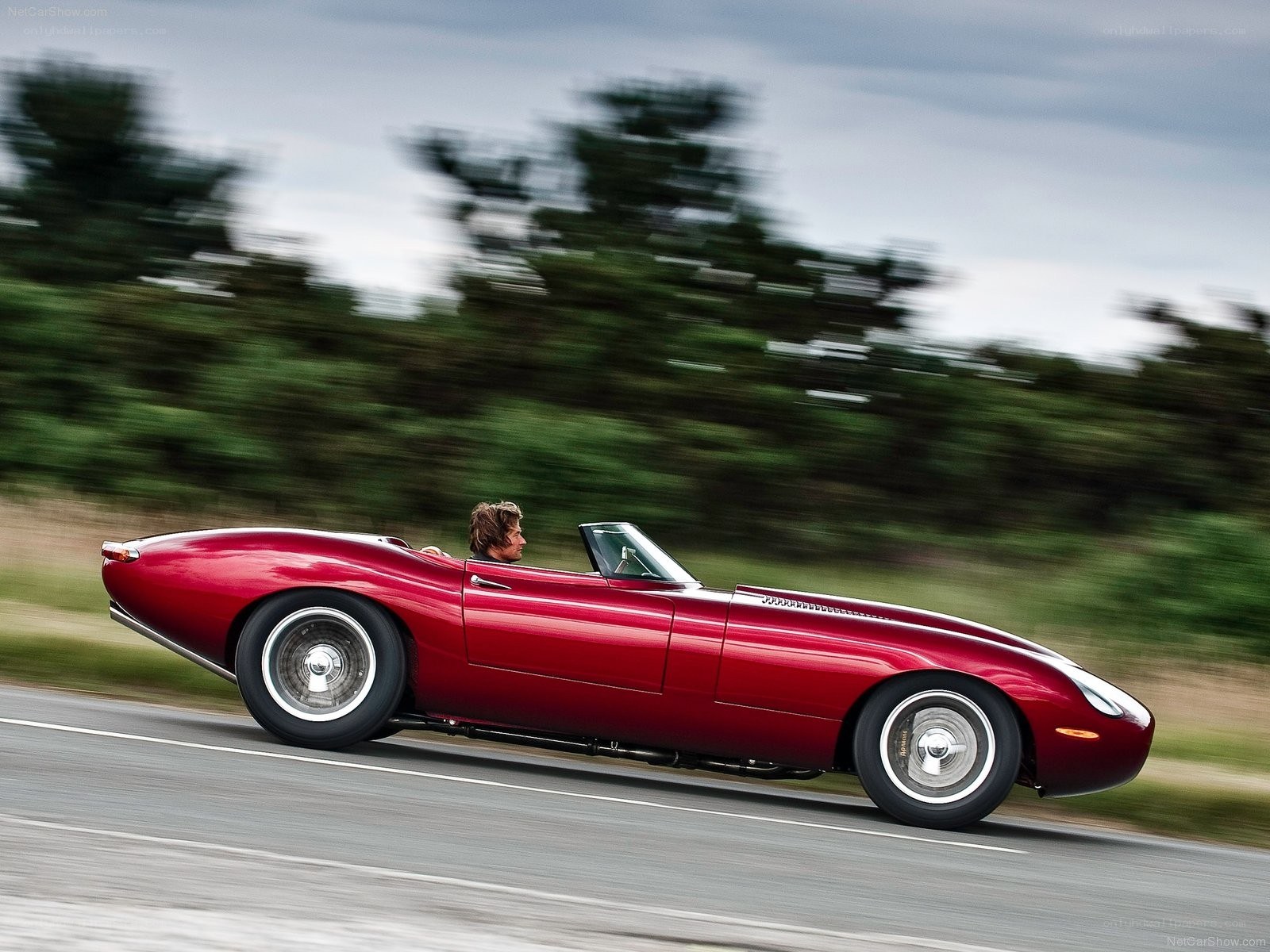Red classic convertible in motion
