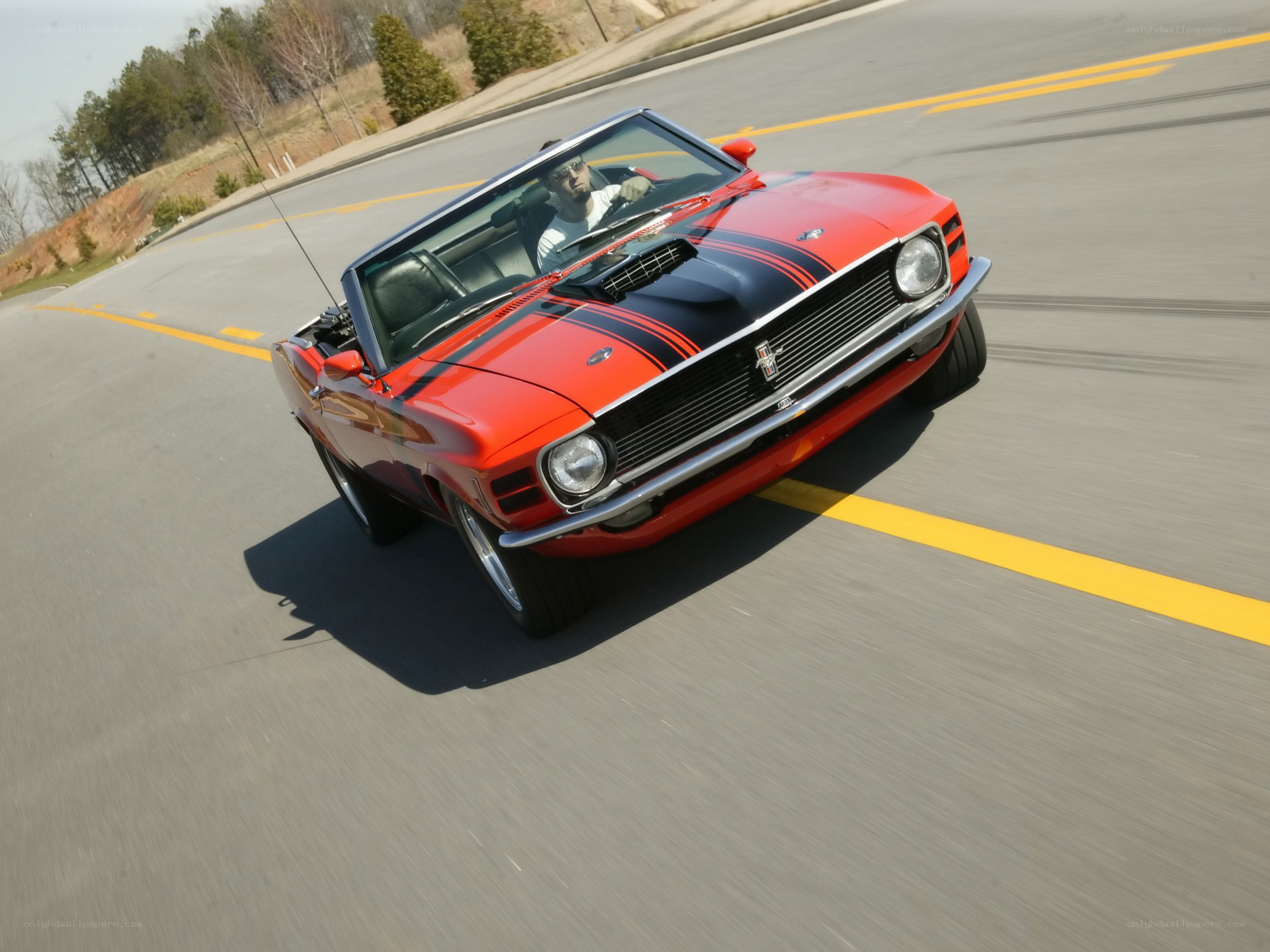 Red classic convertible in motion