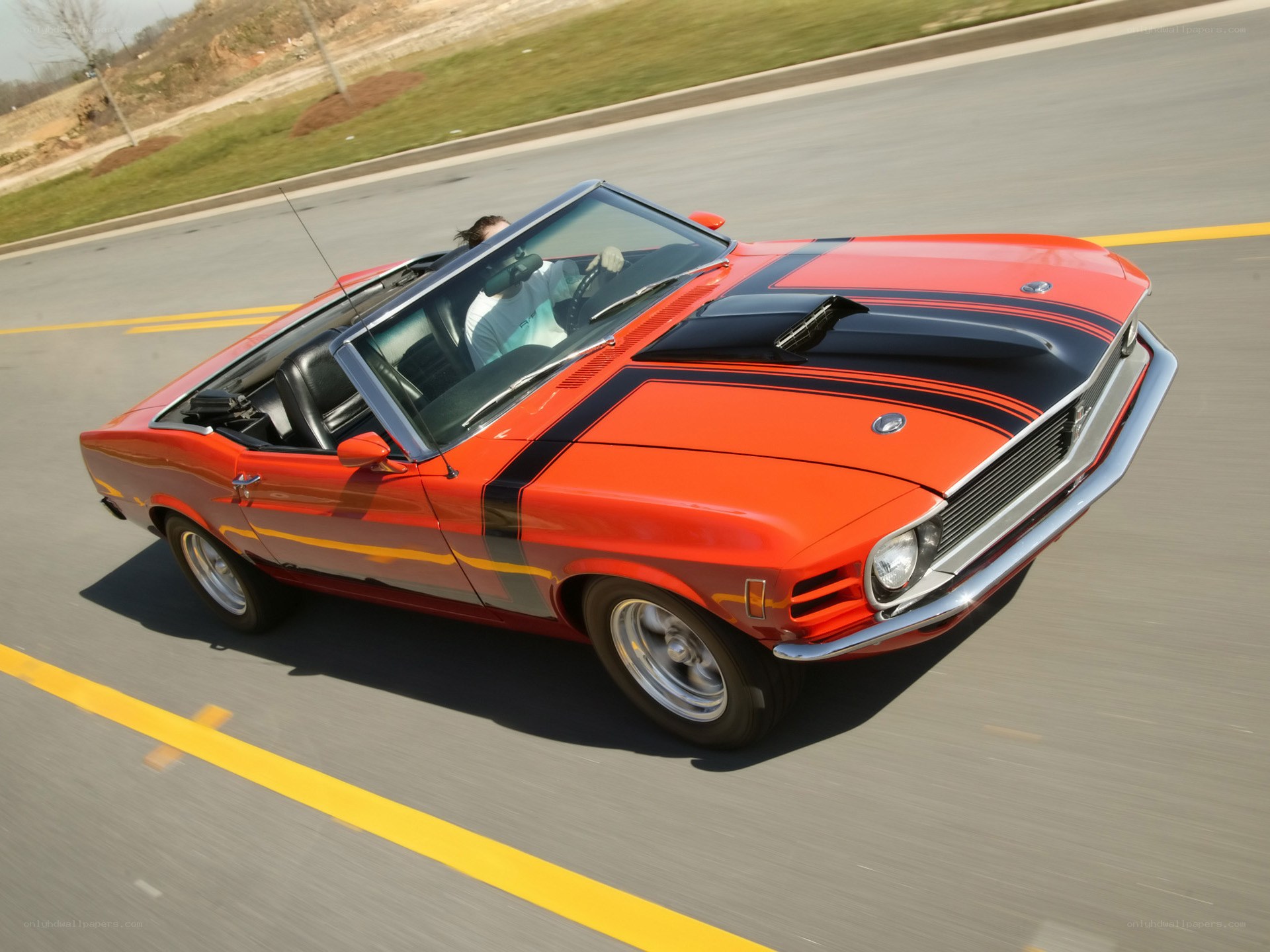 Red classic convertible on road