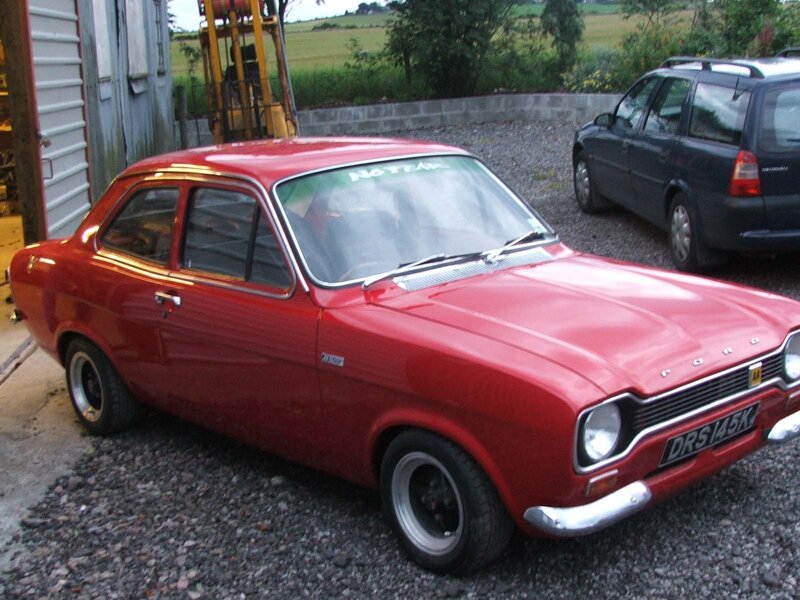 Red classic Ford Escort