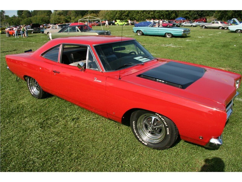 Red classic muscle car at show