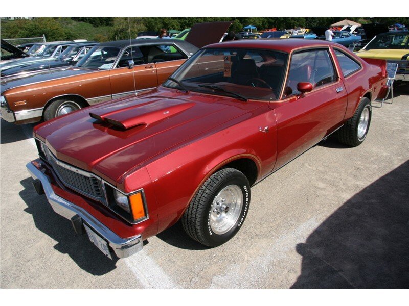 Red classic muscle car at show