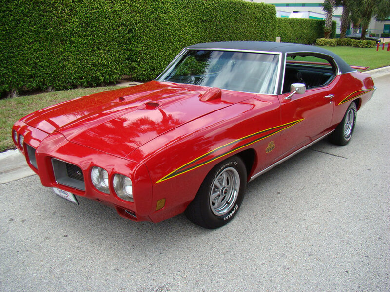 Red Classic Muscle Car — Calm, Afternoon, Photograph, Hedge