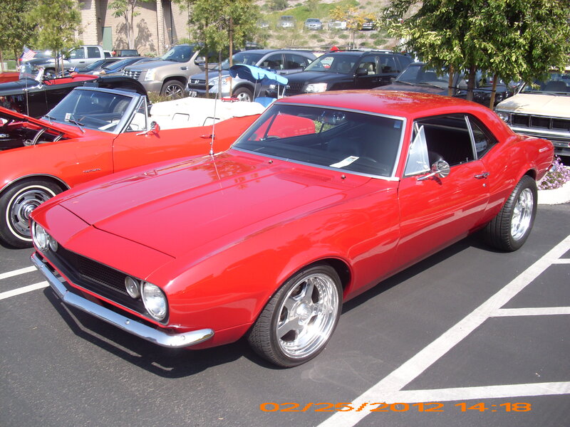 Red Classic Muscle Car — Calm, Afternoon, Photograph, Parking Lot, Other Cars